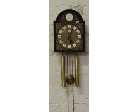 A Junghans musical twin weight wall clock with longcase clock type arch top dial.