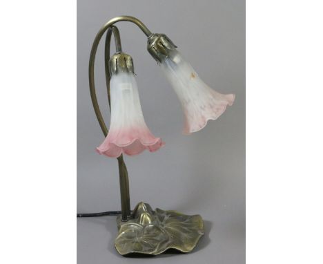 An Art Nouveau style two branch tablelamp and shades.