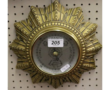 A gilt painted anaroid barometer by Shortland of Manchester, England.
