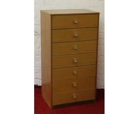 A retro light oak seven high Wellington chest.