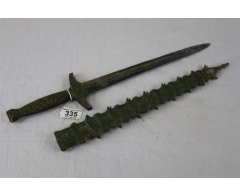 An Asian reproduction dagger, foliate scroll decorated handle, pagoda style scabbard, length approximately 52cm