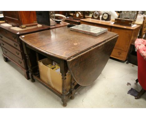 Large 17th century Style Oak Gate-leg Table with Oval Flaps raised on turned supports with square cross stretchers 