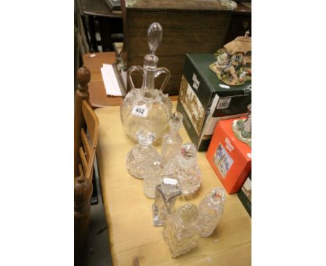 Collection of cut glass and other scent bottles with stoppers plus a 19th Century Continental decanter with engraved decorati