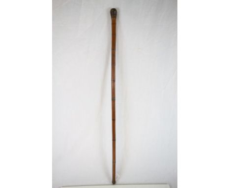 Bamboo walking stick with carved Oriental figures