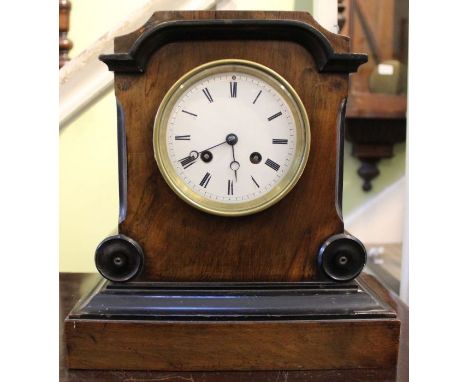 A wooden mantel clock