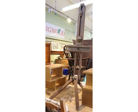 A large sized adjustable artists easel.