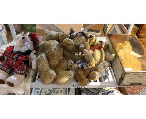 A shelf of teddy bears.