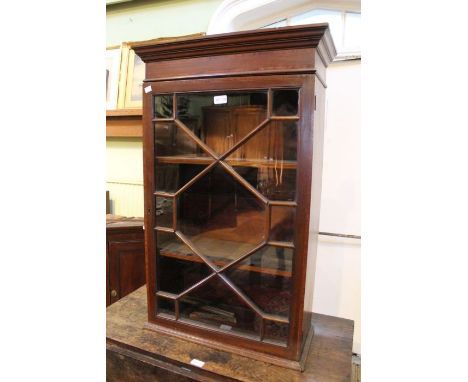 A 19th century mahogany glazed shelf unit, satinwood inlay. Having single astragal glazed door. 93 cm high.&nbsp;