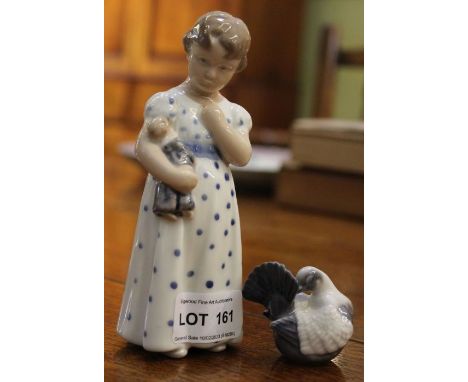 A Royal Copenhagen ceramic figure of a little girl with a small model dove.