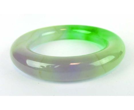 A green/white jade bangle, internal d. 5.6 cm