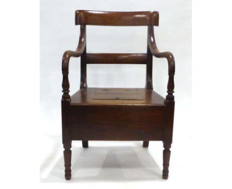 An 18th century oak commode chair