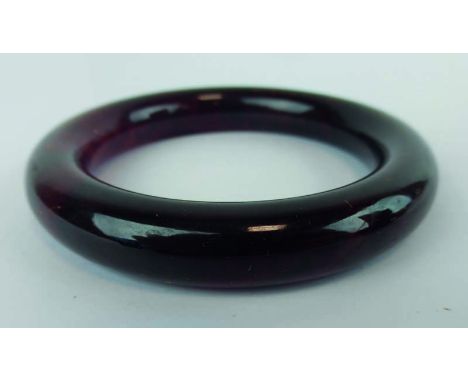 An amber jade bangle, internal d. 5.8 cm