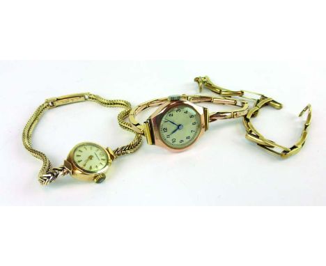 A 9ct yellow gold ladies wristwatch by Garrard, the circular dial with gold coloured baton numerals on an articulated bracele