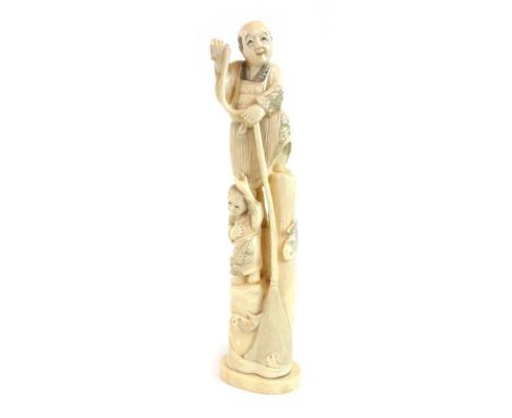 A 19th century Japanese carved ivory okimono depicting a father and son fishing, h. 23.5 cm CONDITION REPORT: Splits to base.