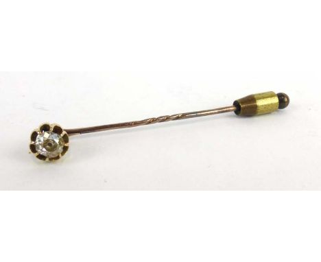 A yellow metal stick pin set old cut diamond in an eight claw setting, l. 6.6 cm CONDITION REPORT: Stone with chips and of po