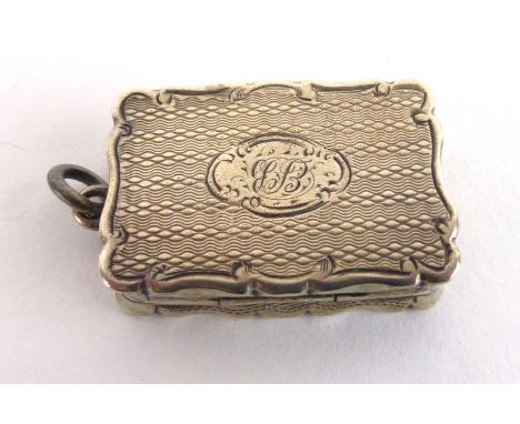A Victorian silver, parcel gilt and engine turned vinaigrette of scalloped rectangular form, maker George Unite, Birmingham 1