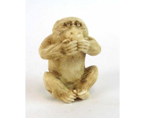 A Meiji carved ivory netsuke modelled as one of the three wise monkeys, h. 4.5 cm,  CONDITION REPORT: Cracks