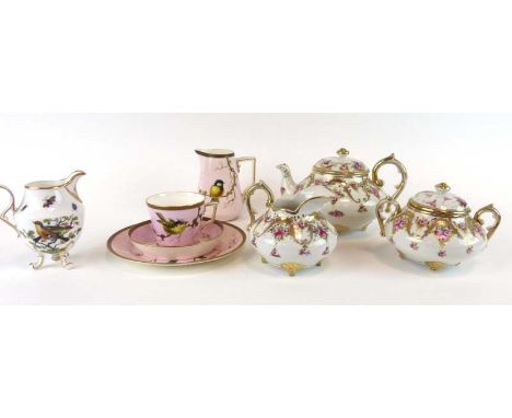 An Aesthetic Movement trio decorated with song birds on a pale pink ground, together with a matching milk jug, a part tea ser