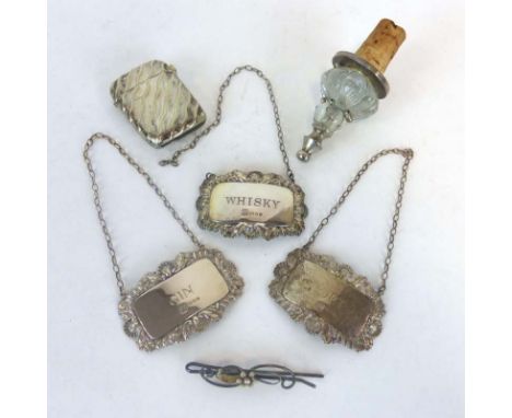 A mixed parcel of items consisting three silver decanter labels, a metalware vesta case, a bar brooch and a metalware mounted