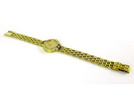 An 18ct yellow gold cased ladies wristwatch by Baume & Mercier, the circular dial with diamond hour markers within a diamond 