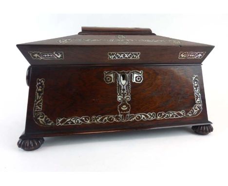 A 19th century rosewood and mother-of-pearl inlaid tea caddy of sarcophogus form, the interior with two fitted cannisters and