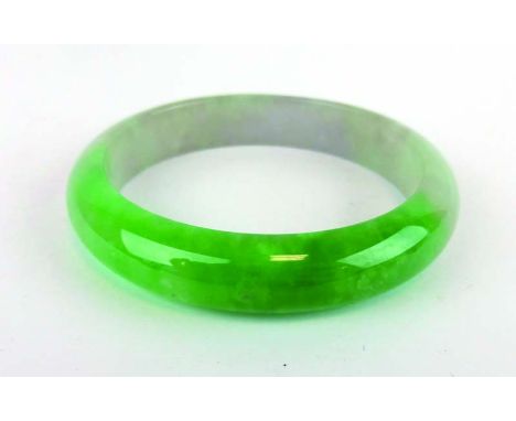 A green/white jade bangle, internal d. 6.3 cm