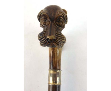 A 20th century walking stick, the resin pommel moulded as a dog