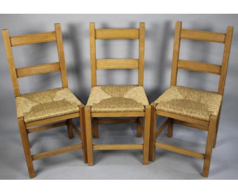 A Set of Three Modern Rush Seated Ladder Back Kitchen Chairs 