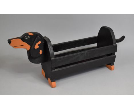 A Modern Wooden Novelty Newspaper Store or Planter in the Form of a Dachsund, 69cms Wide 