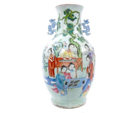 Late 19th century Chinese famille rose vase with dragon handles and polychrome painted domestic scene with ladies playing boa