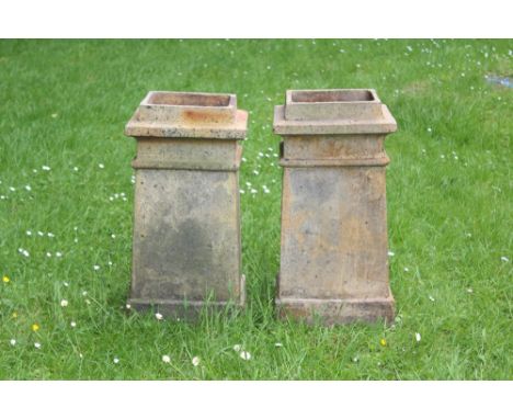 Pair of Victorian ceramic chimney pots of stepped square form, 65cm high