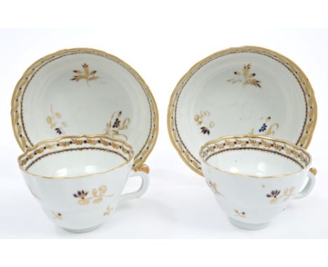 Pair late 18th century Chinese export breakfast cups and saucers with painted blue and gilt floral sprigs, circa 1790