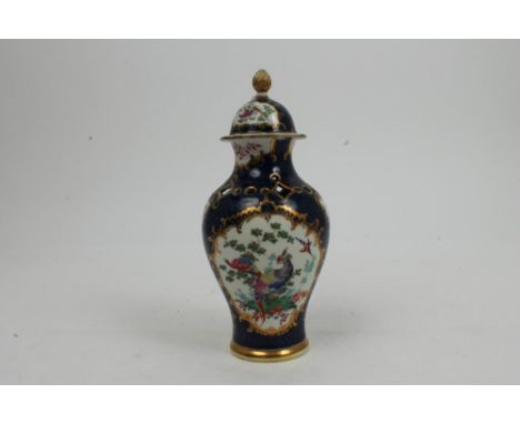 18th century Worcester potpourri vase and cover with polychrome painted exotic bird reserves on blue scale ground with gilt s