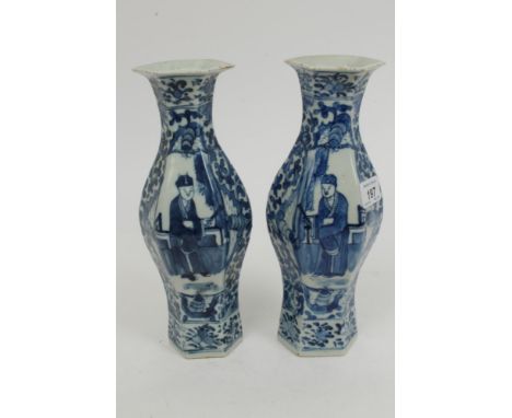 Pair early 20th century Chinese blue and white hexagonal vases of swollen form, with figure with fan, bat and floral scroll d