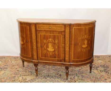 19th century Italian walnut and marquetry inlaid bowed commode, the shaped top with inlaid cartouche, enclosed by three cupbo