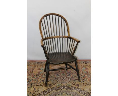 19th century ash and elm stick back elbow Windsor chair with spindle back and saddle seat on turned supports