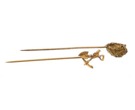 Early 20th century 'gold mining' stick pin and a similar gilt metal 'nugget' stick pin (2)