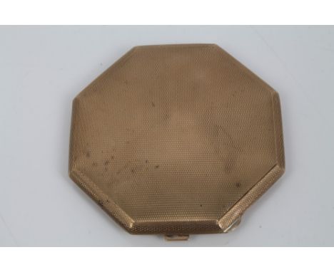 Art Deco gold (9ct) powder compact of octagonal form with engine-turned decoration (London 1933), 75mm diameter