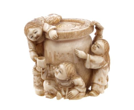 Late 19th / early 20th century Japanese Meiji period carved ivory netsuke depicting figures availing themselves of the conten