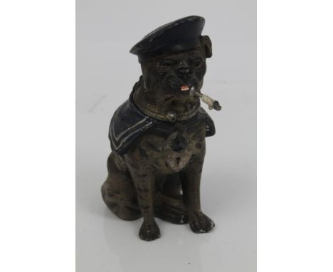 Early 20th century novelty cold painted white metal money box in the form of a seated dog in sailor costume and smoking a pip