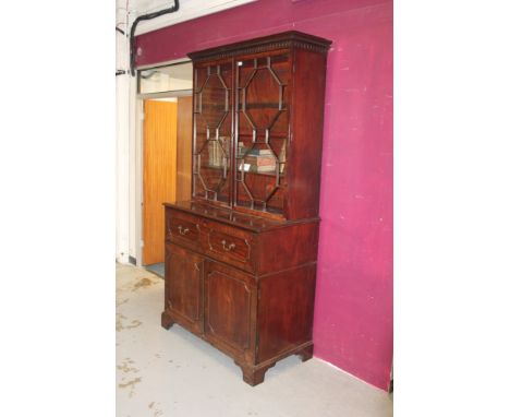 George III mahogany secretaire bookcase with dentil and fancy cornice, two astragal glazed doors enclosing adjustable shelves