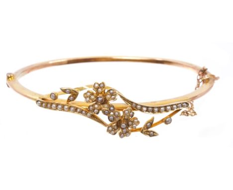 Late Victorian gold and seed pearl bangle with trailing seed pearl foliage, in a crossover design CONDITION REPORT Approx. 17