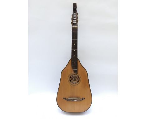 A circa 1950s German Perl Gold lute guitar with soft carry case.