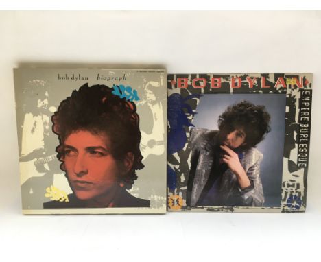 Two Bob Dylan LPs comprising the 5LP deluxe edition box set 'Biograph' and 'Street Legal'.