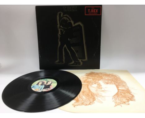 A first UK pressing of 'Electric Warrior' by T Rex complete with portrait inner sleeve and poster insert. Ringwear to outer s