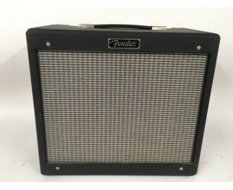 A Fender Blues Junior guitar amplifier.