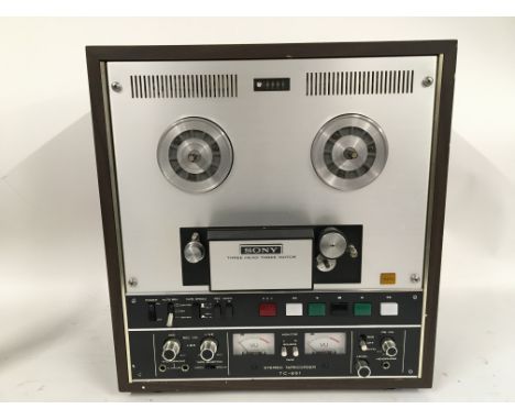 A Sony stereo tapecorder TC-651 reel to reel machine plus one other Sony TC377 reel to reel plus a box of reels and accessori