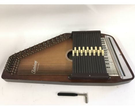 An Oscar Schmidt autoharp and tuning fork (2).