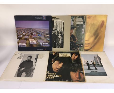 Seven LPs by various artists including The Rolling Stones, Pink Floyd and Bob Dylan.