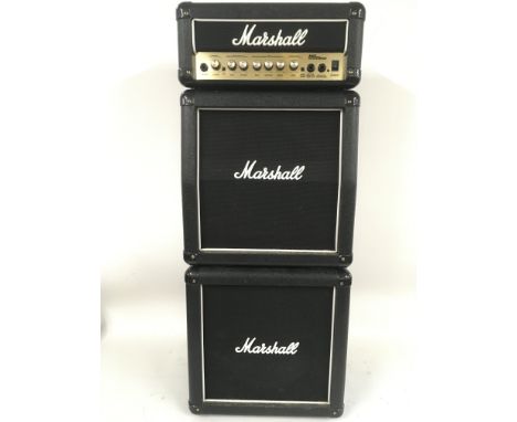 A Marshall MG15 MSII mini stacking amplifier with power supply and connector cables.